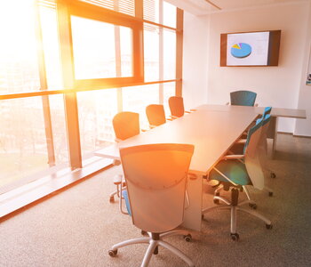 Interior of new modern office meeting room with big windows